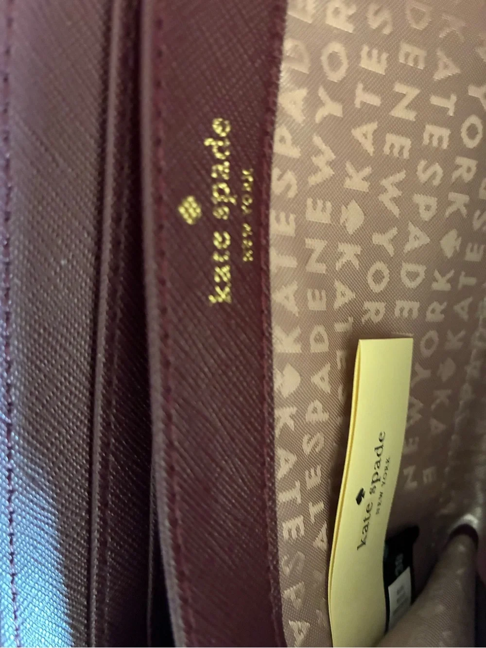 kate spade plum/burgundy zip-around card wallet with gold logo